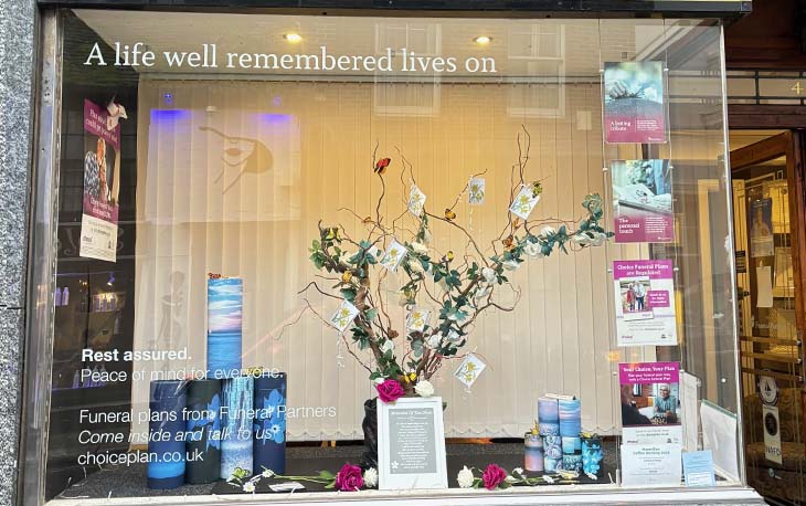 Front of branch window decorated for Mother's Day